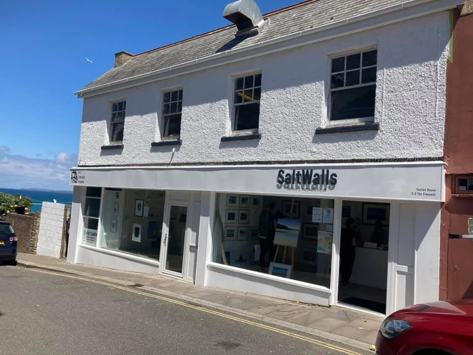 Finished white-painted commercial shopfront on a Swansea high street