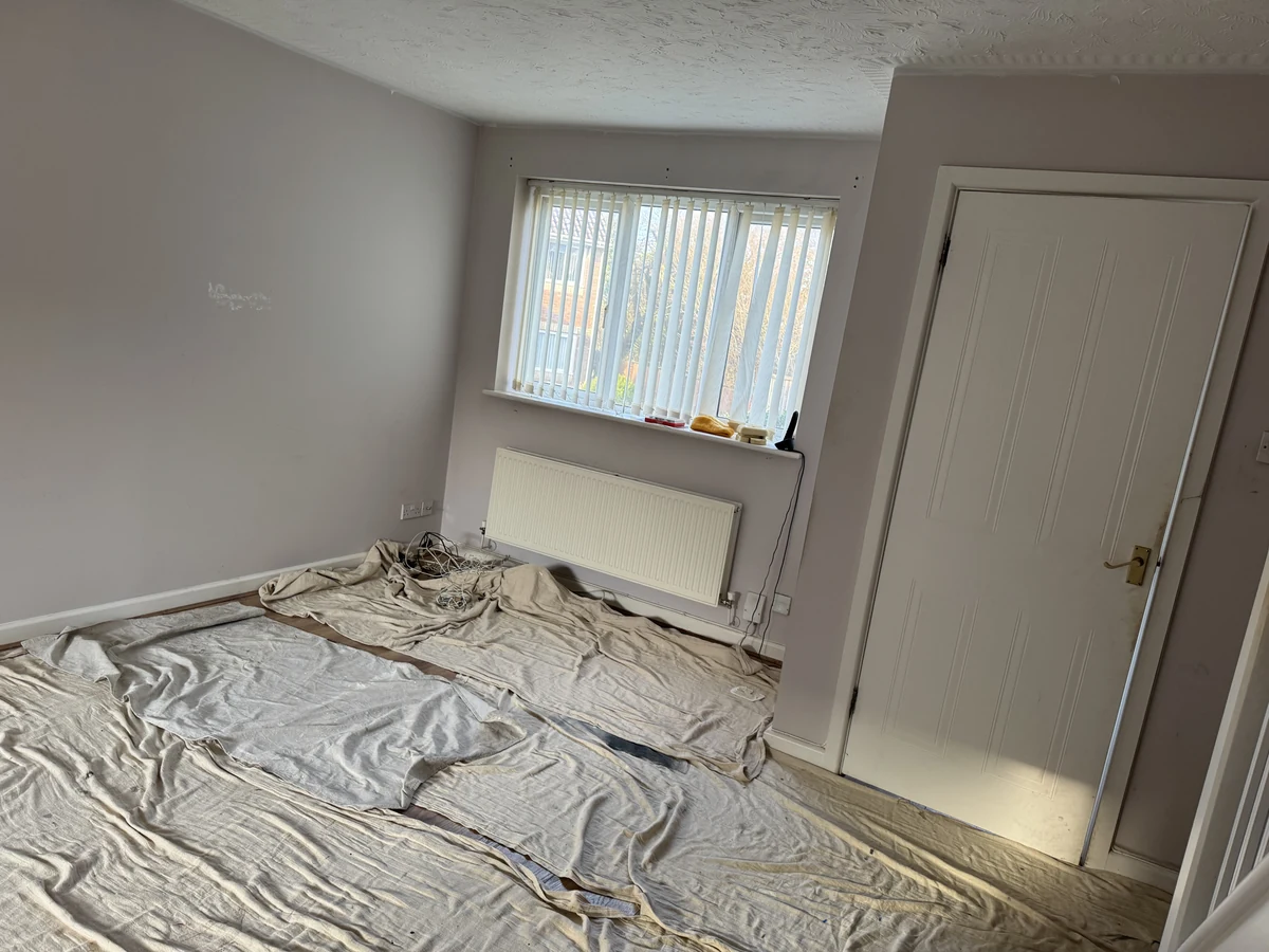 Dust sheets down and tools out while a Swansea lounge is repainted