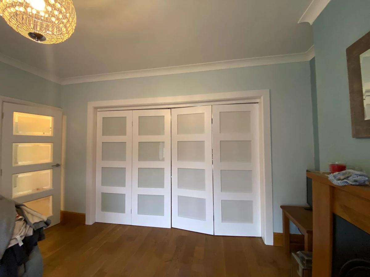 Finished Swansea living room with new white double doors and flooring