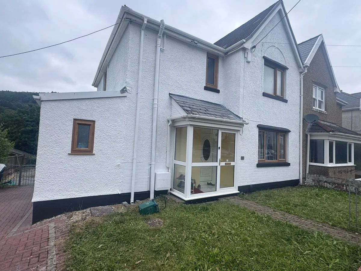 Finished white rendered house exterior in Swansea