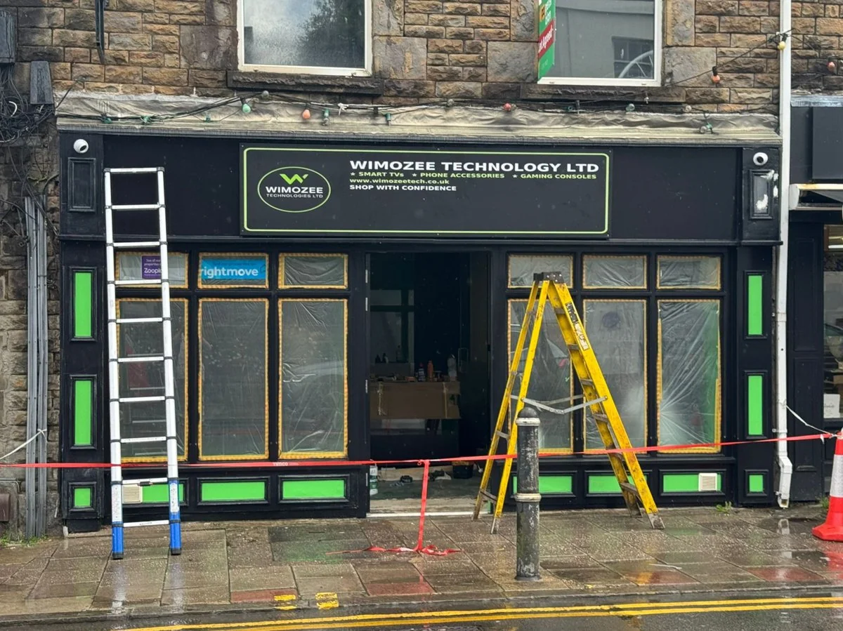Finished Wimozee Technology shopfront with black and green fascia in Morriston, Swansea